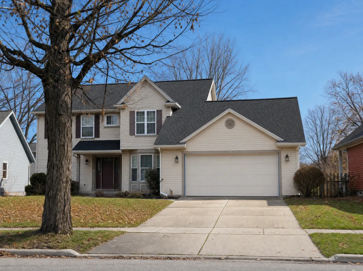 After: new charcoal architectural shingle roof on the same home in Portage, Michigan